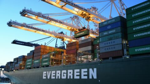 green and gray evergreen cargo ship