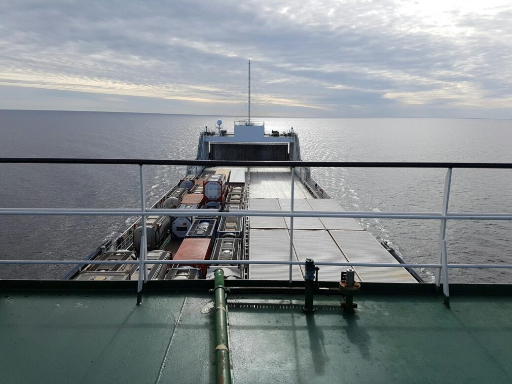 photo of cargo ship on body of water