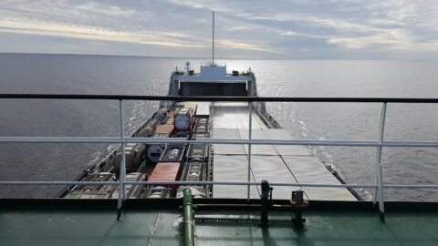 photo of cargo ship on body of water