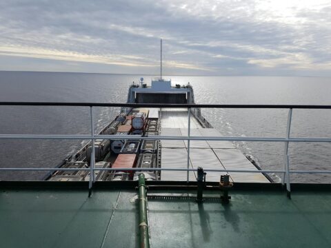 photo of cargo ship on body of water
