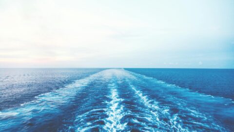 blue body of water under clear blue sky