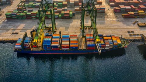 drone shot of a cargo ship on port